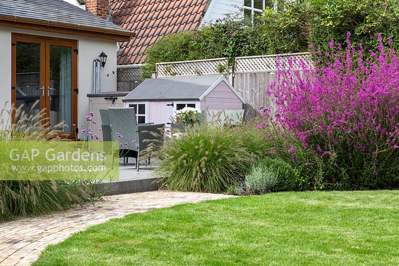 Lawn with patio, Pennisetum and Lythrum 