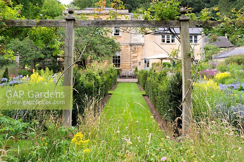 Meadow planting and pergola with perennials and grasses, Wiltshire, England, UK