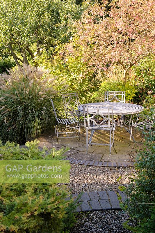 Garden seating area on patio, Shropshire, UK