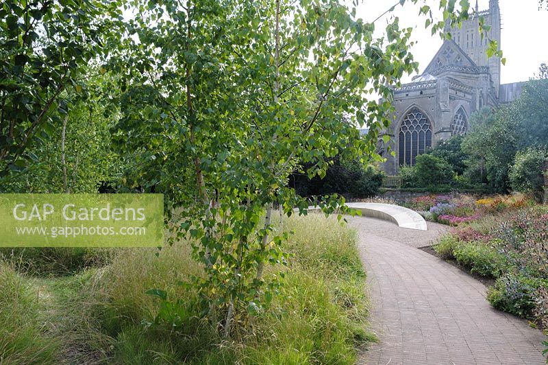 The Garden of Reflection features a grove of 85 silver birch trees, a 40' 
long stone seat inscribed with the words 'Wanderer, there is no path, the 
path is made by walking', and a border of late summer herbaceous perennials 
and grasses 