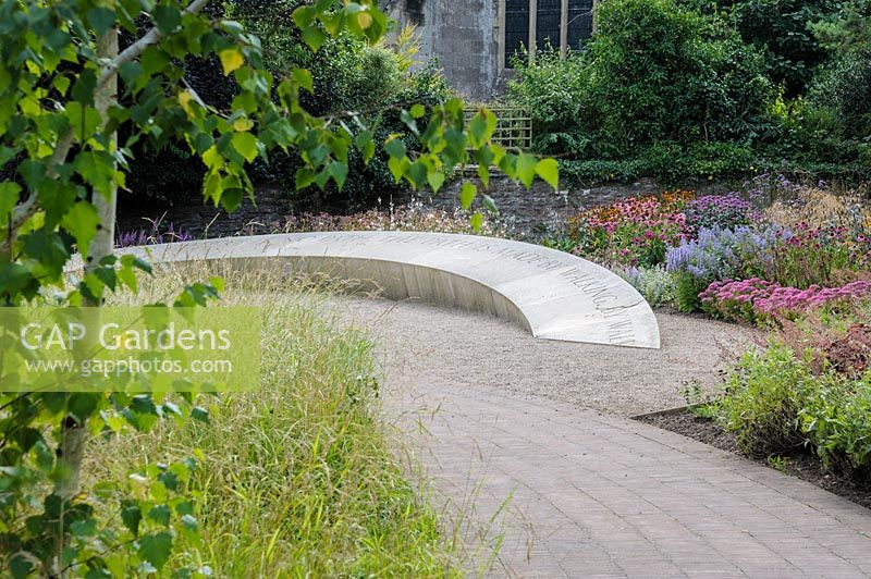 The Garden of Reflection features a grove of 85 silver birch trees, a 40' long 
stone seat inscribed with the words 'Wanderer, there is no path, the path is 
made by walking', and a border of late summer herbaceous perennials and grasses