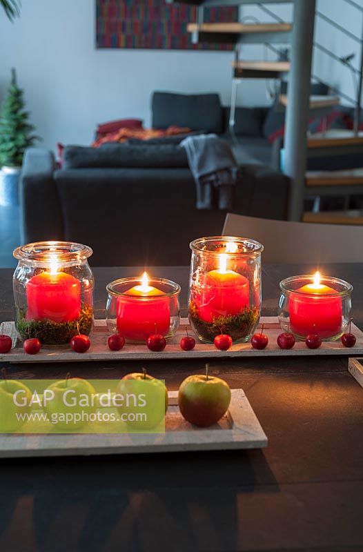 View of contemporary advent candle decorations on coffee table.