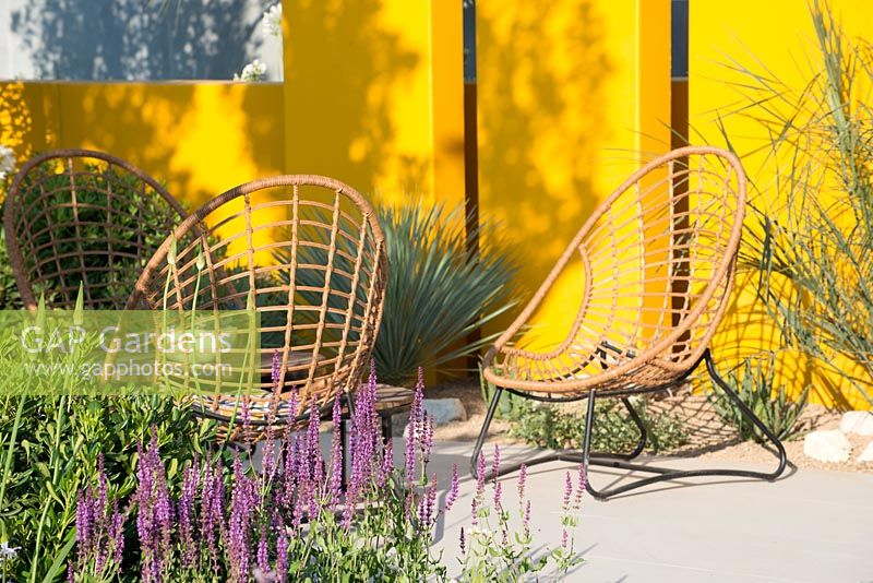 Wooden chairs in show garden - Santa Rita 'Living La Vida 120' Garden, Sponsored by Santa Rita Wines, RHS Hampton Court Palace Flower Show, 2018. 