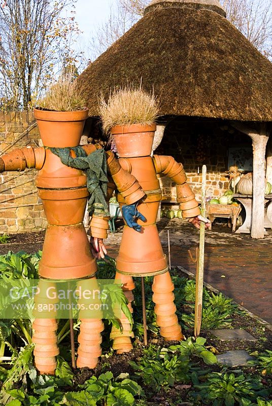 Terracotta pot couple in the Vegetable garden. RHS Garden Rosemoor, Devon, UK.