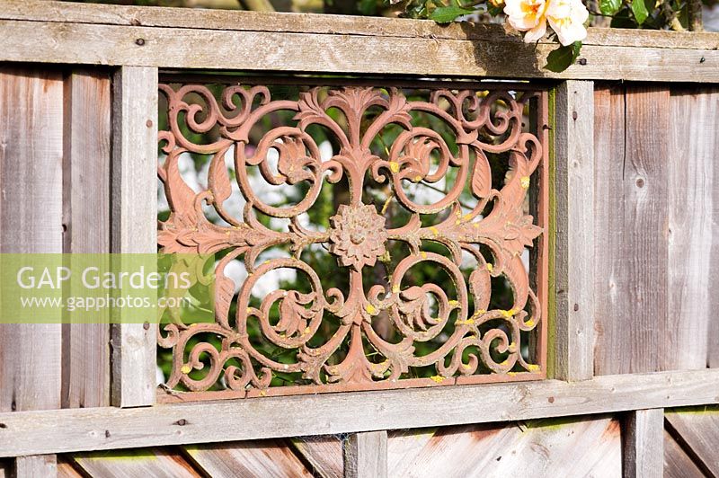 Metal doormat set into fence to form decorative grille. Hilltop, Stour Provost, Dorset, UK. 