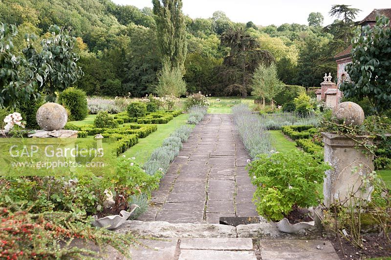 Lavender edged path with box parterres. Heale House, Middle Woodford, Salisbury, Wiltshire, UK