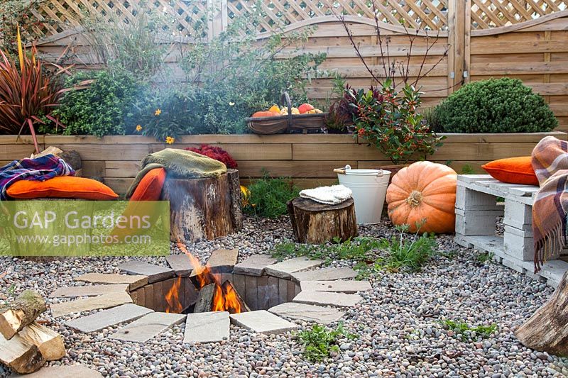 Finished firepit in use in Autumnal setting. 