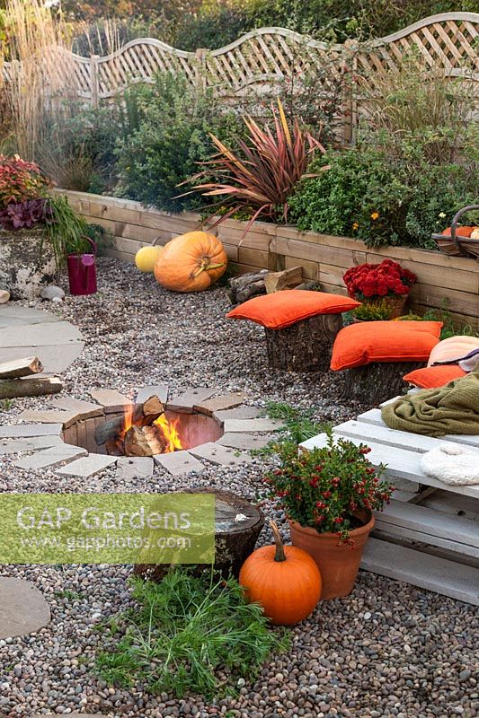 Finished firepit in use in Autumnal setting.