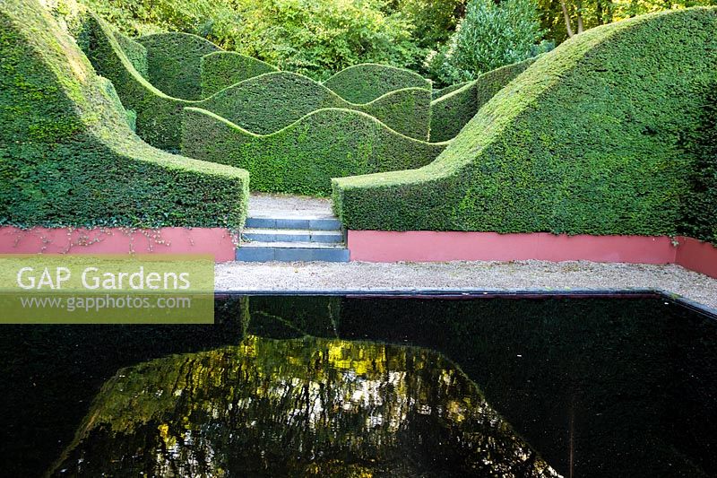 View over the Reflecting Pool to the Hedge Garden. Veddw House Garden, Monmouthshire, Wales, UK.
