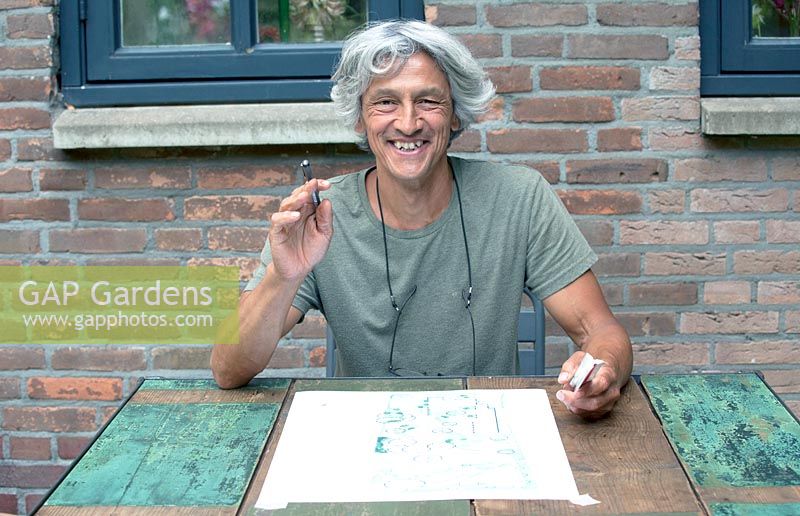 Paul Samuels with sketch of garden design, Netherlands