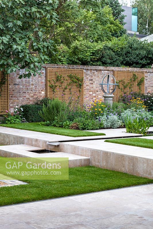 View up the steps to Contemporary garden in Highgate,  London. Garden designed by Peter Reader Landscapes.