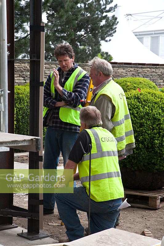 Tom Stuart-Smith and construction team review progress in preparation for RHS Chelsea Flower Show. 