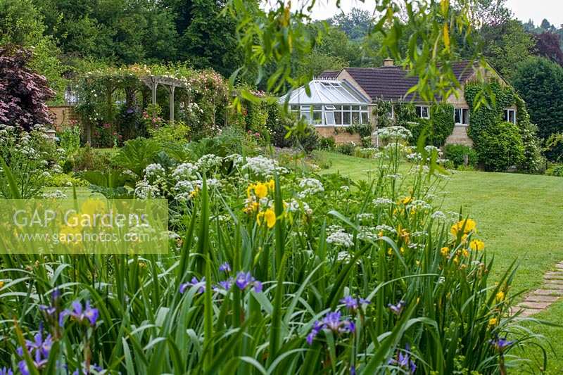 View across large country garden. Hill Lodge Garden, Batheaston, Somerset. UK.