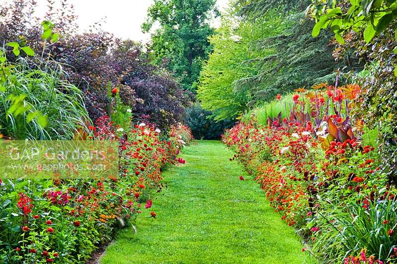 View down red themed double borders. Weihenstephan Trial Garden, Germany. 