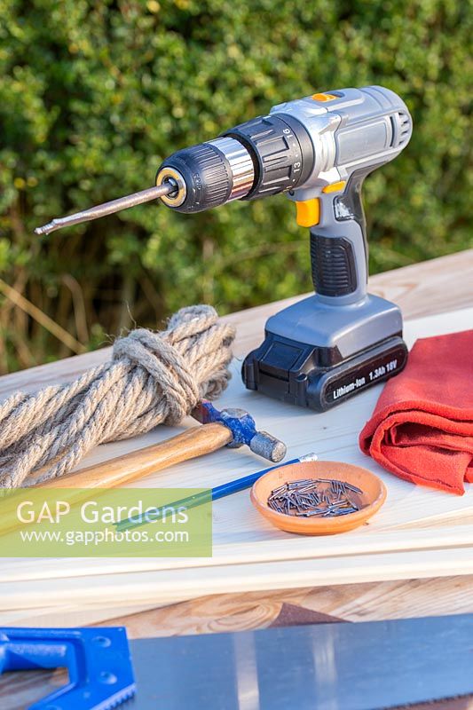 Tools and materials for making hanging bird feeding table.