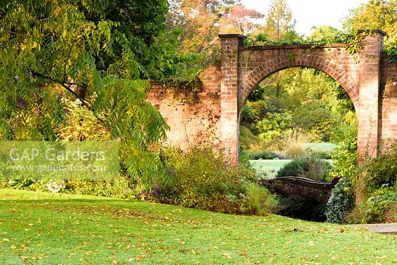 Arched opening in the wall surrounding the Round Garden at Llanover Gardens, Monmouthshire, UK. 