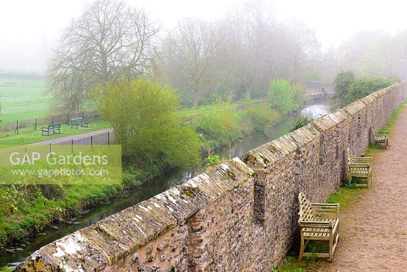 View over the ramparts to the moat surrounding the Bishop's Palace Garden, Wells, Somerset, UK. 