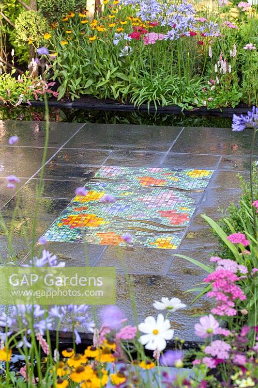 Mosaic by Nickie Bonn and Art4Space, inset into paving, in the 'Brilliance in Bloom' garden 
