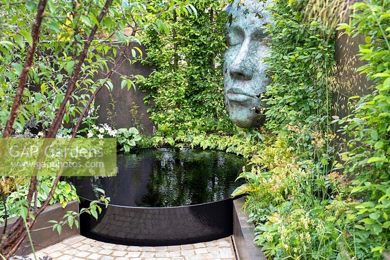 'The Thrive Reflective Mind' garden with raised pond, raised bed and sculpture
 