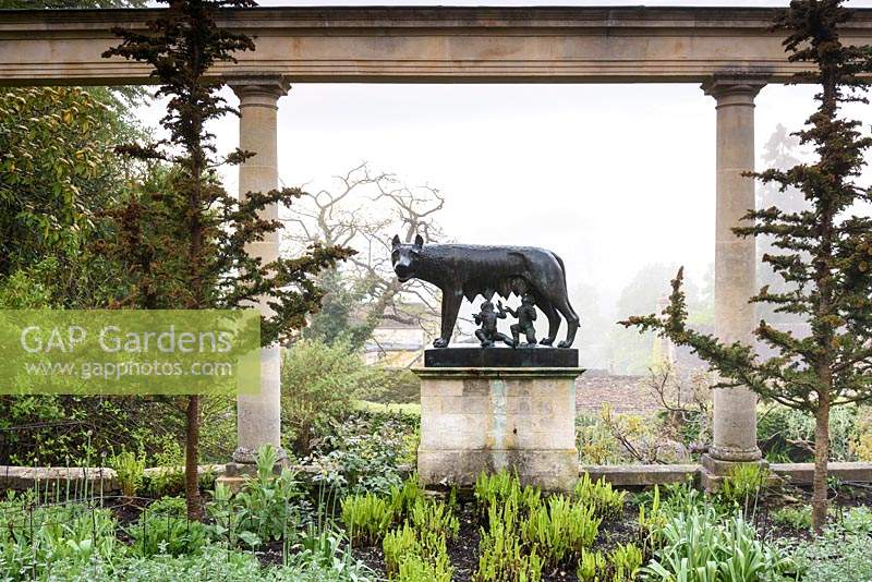 Sculpture of The Capitoline wolf suckling Romulus and Remus - cast from a mould taken from the original at Iford Manor, Bradford-on-Avon, Wiltshire, UK.