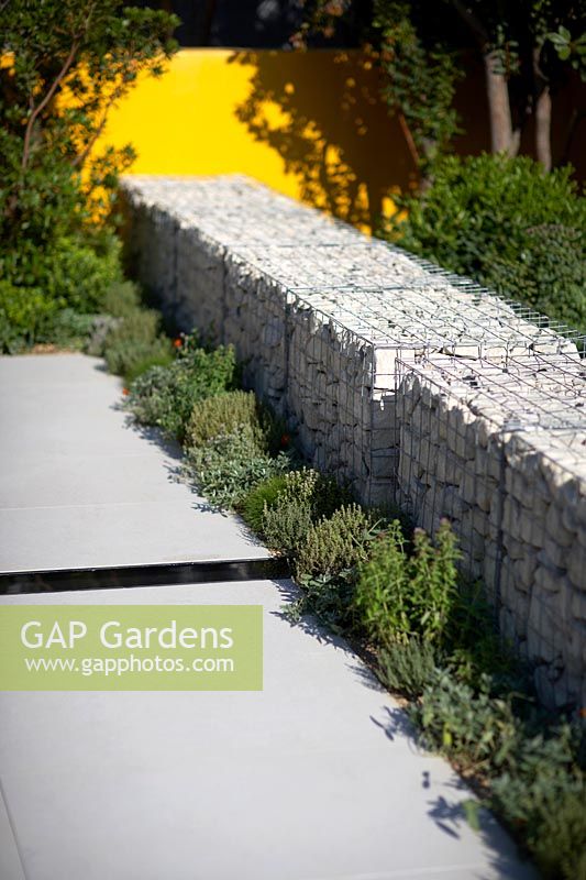 Granite gabions in show garden. Santa Rita 'Living La Vida 120' Garden. Designed by Alan Rudden. Sponsored by Santa Rita Wines. RHS Hampton Court Palace Show, 2018. 
