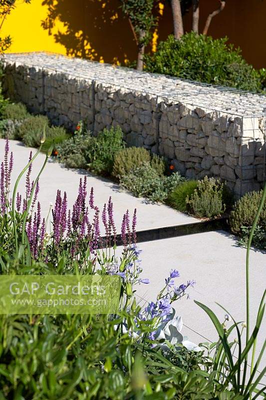 Granite gabions in show garden. Santa Rita 'Living La Vida 120' Garden. Designed by Alan Rudden. Sponsored by Santa Rita Wines. RHS Hampton Court Palace Show, 2018.

