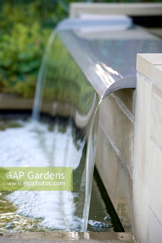 Close up of fountain in modern, water feature. 