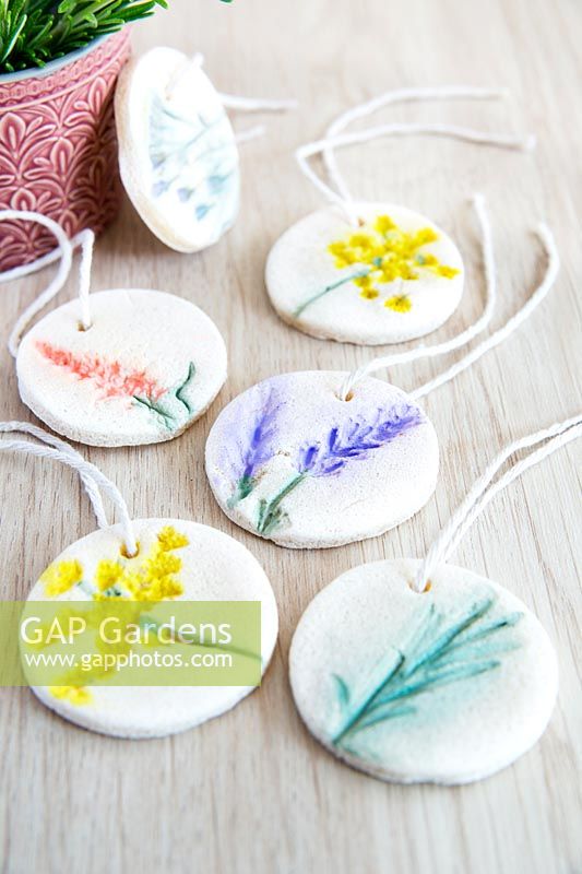 Gift tags made by pressing flowers into salt dough and painting 