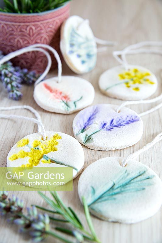 Gift tags created using flowers pressed into salt dough and painted 