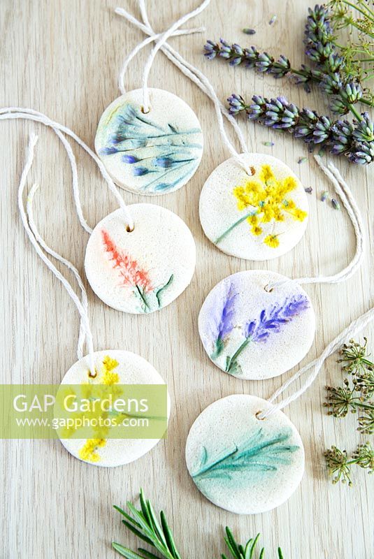 Gift tags made from salt dough and pressed flowers then painted