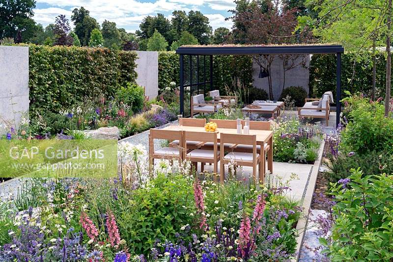 Timber and Steel open garden room with Green living roof. Contemporary outdoor garden. RHS Hampton Court Festival 2019.