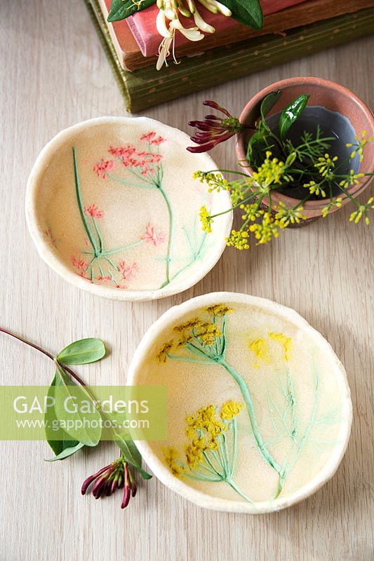 Small bowls made out of salt dough and decorated with painted flower imprints