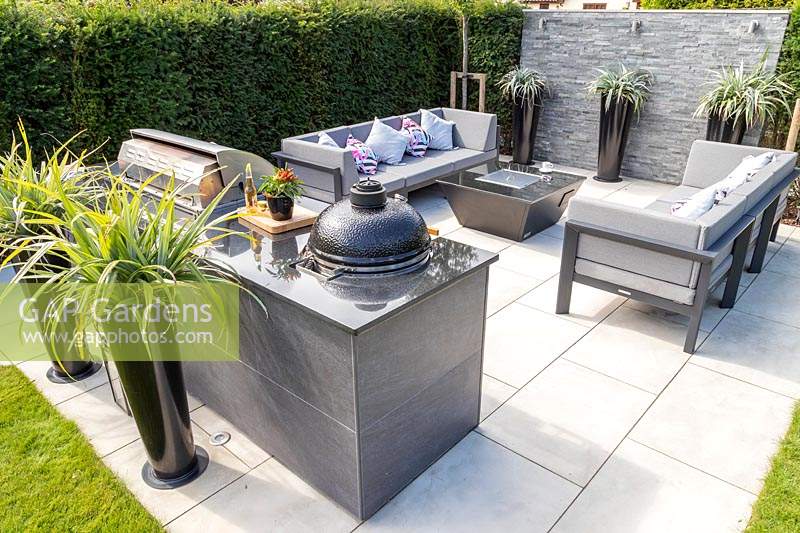 Paved area with built in outdoor kitchen, cooking area and lounge furniture