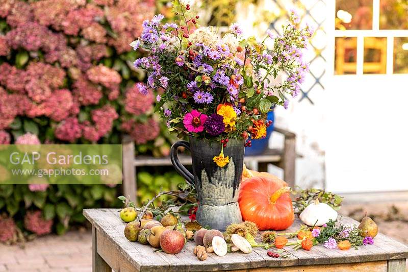 Autumn bouquet sitting on a garden table.