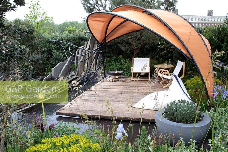 Seating area bordered by water in the Facebook: Beyond The Screen Garden at Chelsea Flower Show 2019 - Sponsor: Facebook - Gold medal