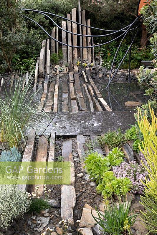 Water feature with planting. Sponsor: Facebook Gold medal. Chelsea Flower Show 2019.