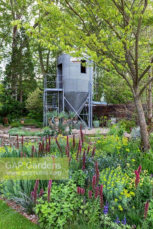 The RHS Chelsea Flower Show 2019. Garden: The Resilience Garden. Repurposed grain silo.