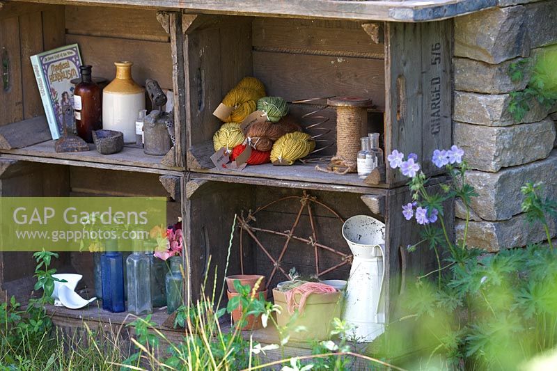The Naturecraft Garden. Detail of old wooden crates used as garden storage space. Sponsor: Belvoir Fruit Farms.