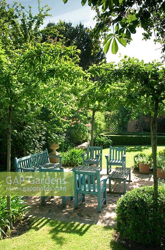 Painted garden furniture in formal spanish garden. 