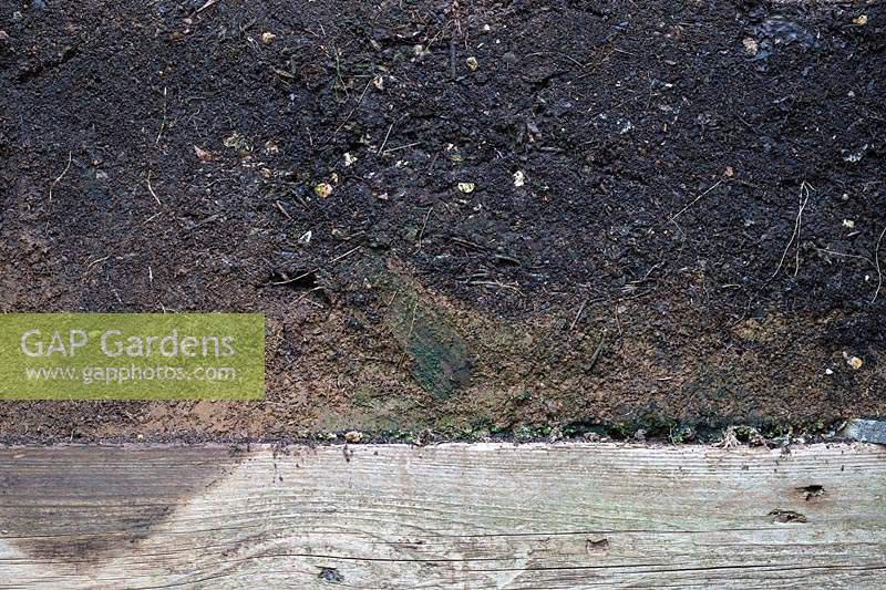 Cross section of a compost heap showing layers of well matured compost