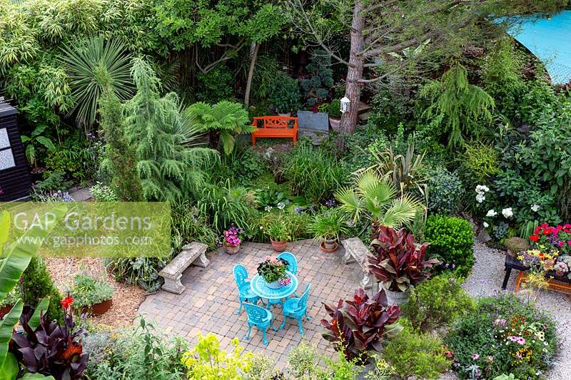Modern cottage garden in West London. High view looking down showing most of the garden with the different areas.