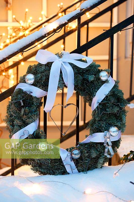 Winter decorations - white themed wreath with ribbons and baubles