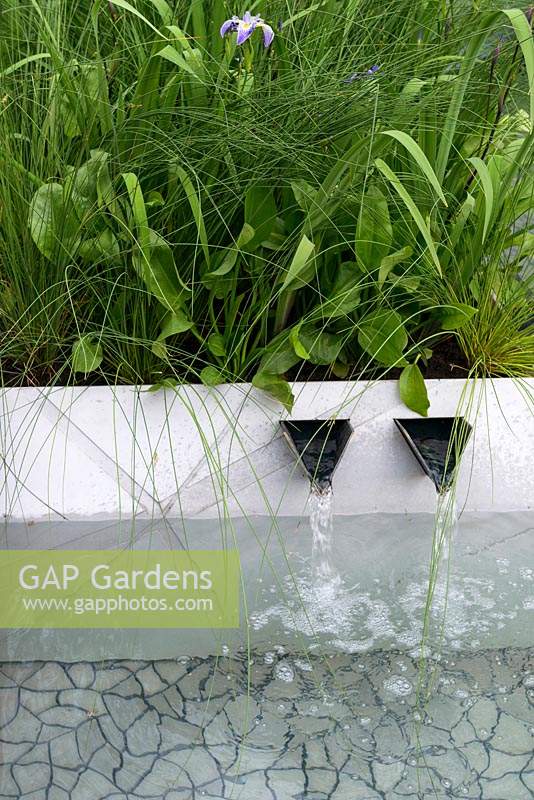 Modern geometric water spouts in The Waterscape Garden at RHS Chelsea Flower Show 2014 - Sponsor: RBC