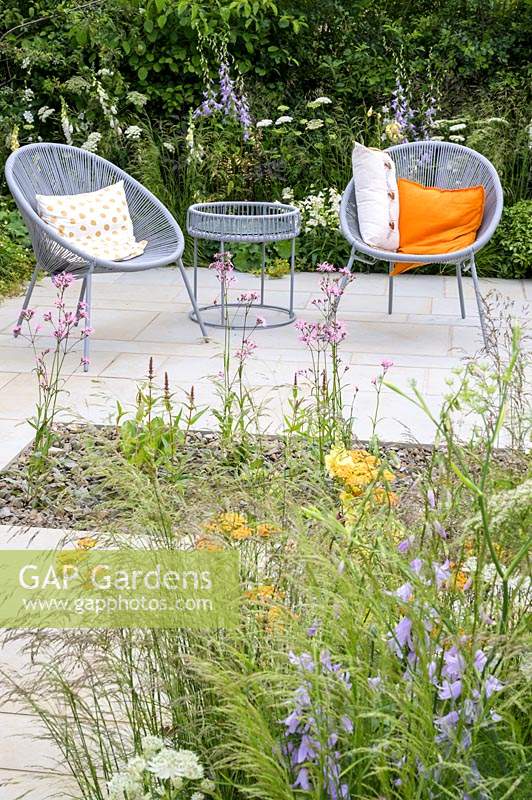 Seating area with two armchairs and planting of nectar-rich flowers - The Urban Pollinator Garden, Designed by Caitlin McLaughlin RHS Hampton Court Palace Garden Festival, 2019 