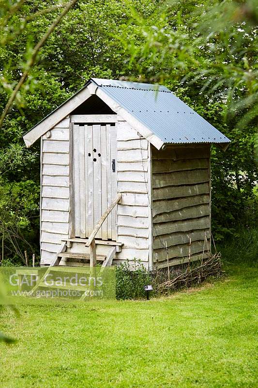 Wooden shed with toilet and shower facilities 