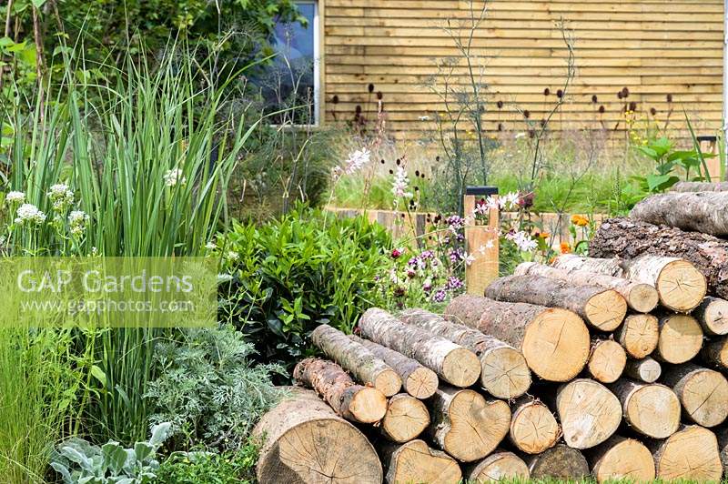 Log arch - Believe in Tomorrow Garden - RHS Hampton Court  Palace Garden Festival 2019 