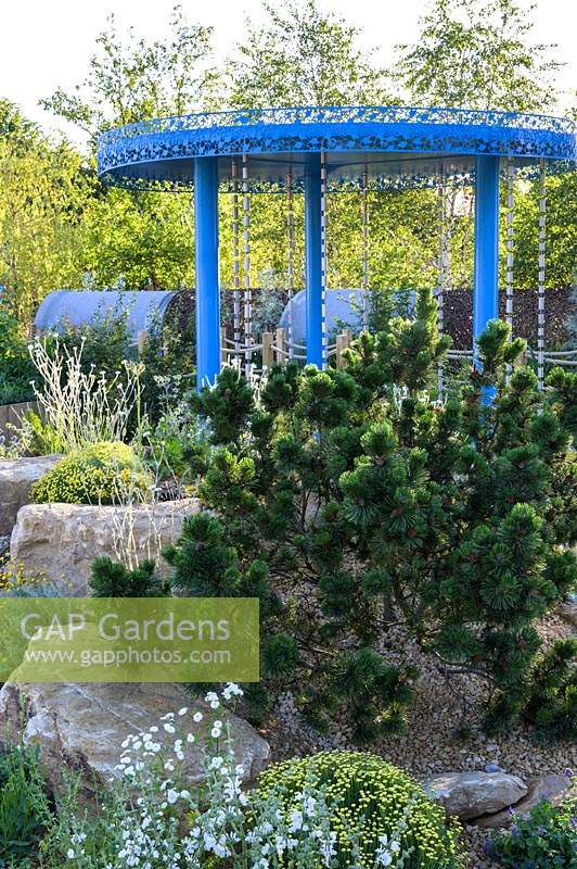 Blue rainfall pavilion with raincatchers and gravel garden. The Thames Water Flourishing Future Garden. RHS Hampton Court Palace Garden Festival, 2019.