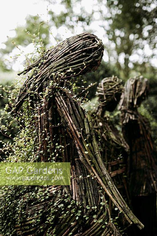 Wicker people by Agnieszka Gradzik and Wiktor Szostalo covered in Muehlenbeckia compactus. Les Jardins d Etretat, Normandy, France