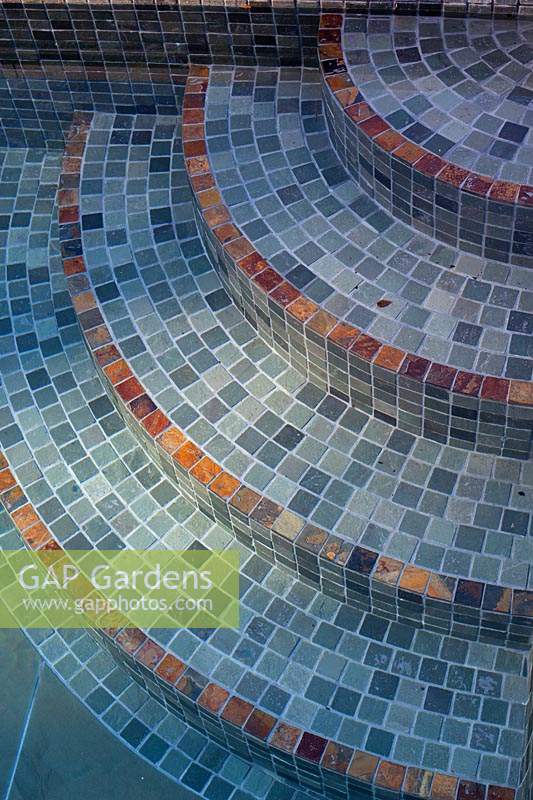 Detail of mosaic steps in swimming pool.