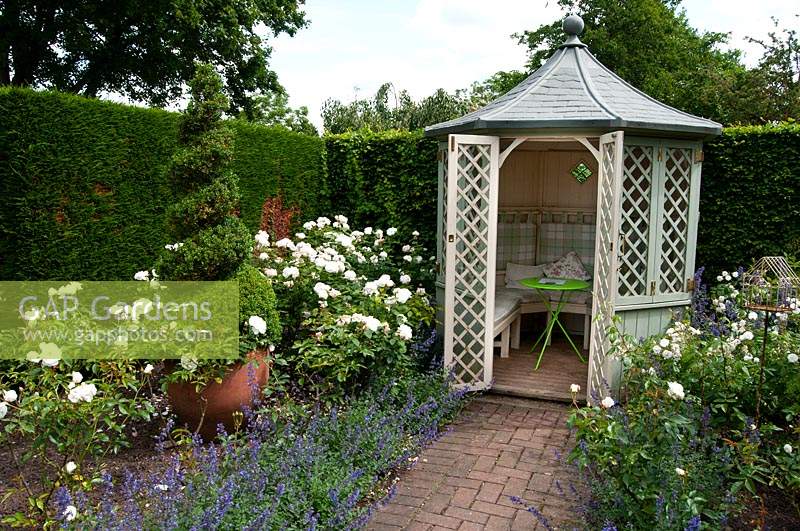 Summerhouse at the end of the rose garden at Wollerton Old Hall Garden, Shropshire.